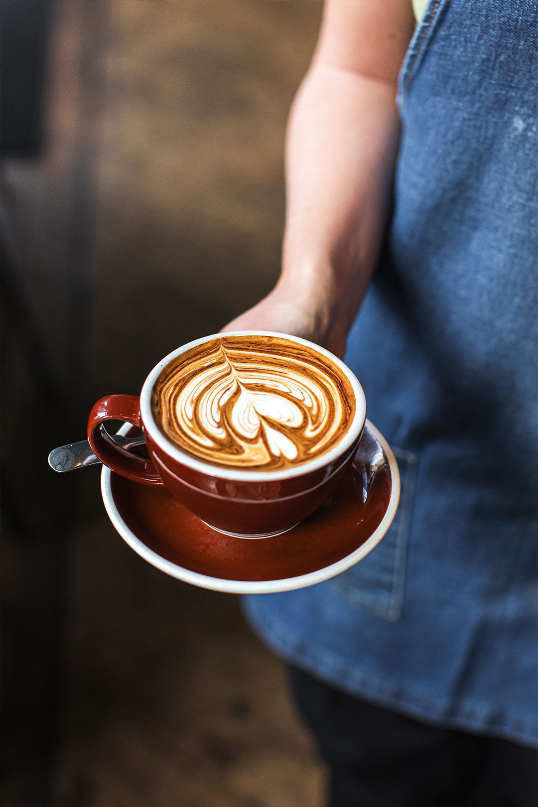Barista pouring flat white Federal Cafe Deansgate Manchester